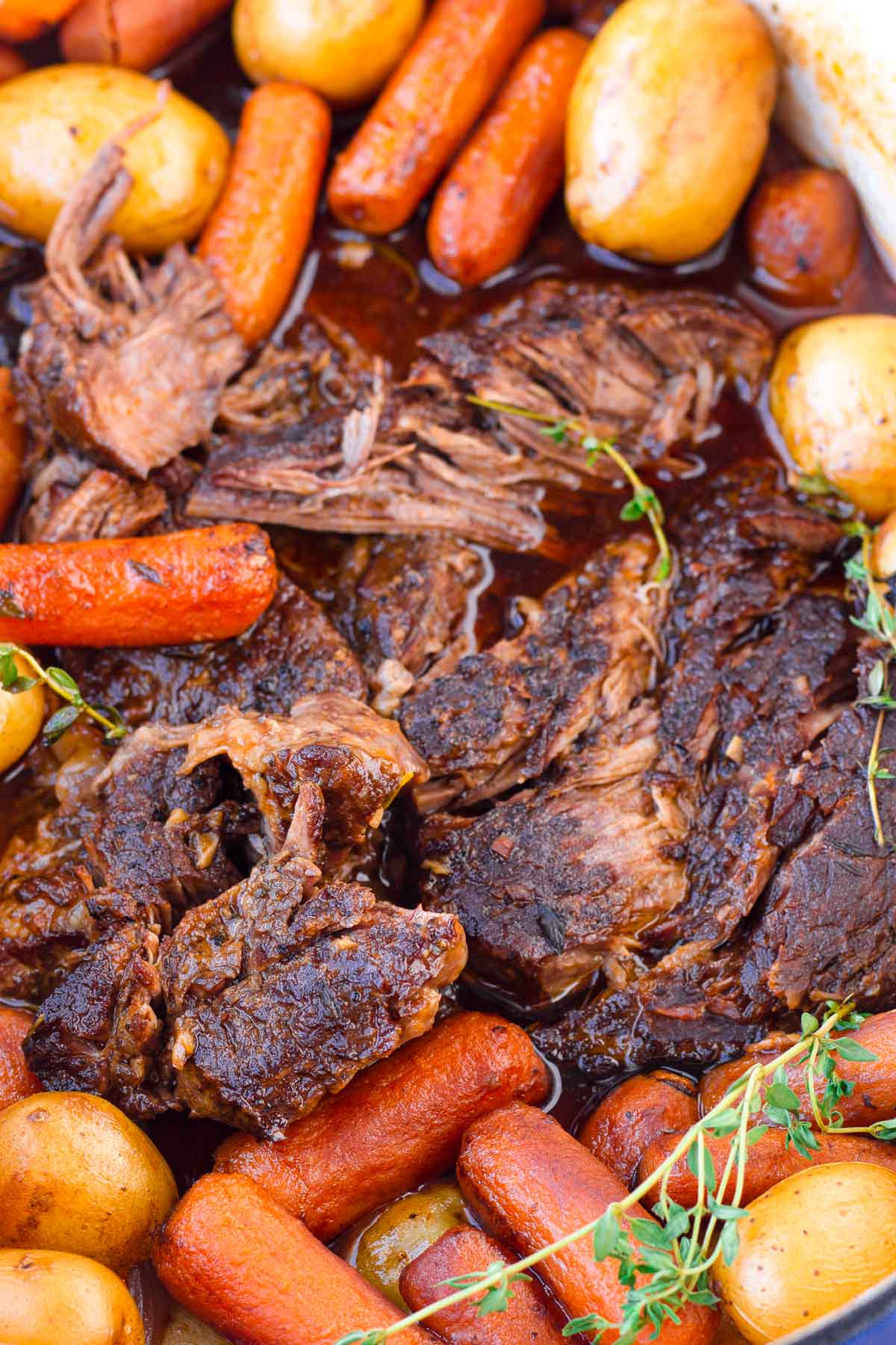 Dutch Oven Pot Roast with Carrots and Potatoes - Feast and Farm