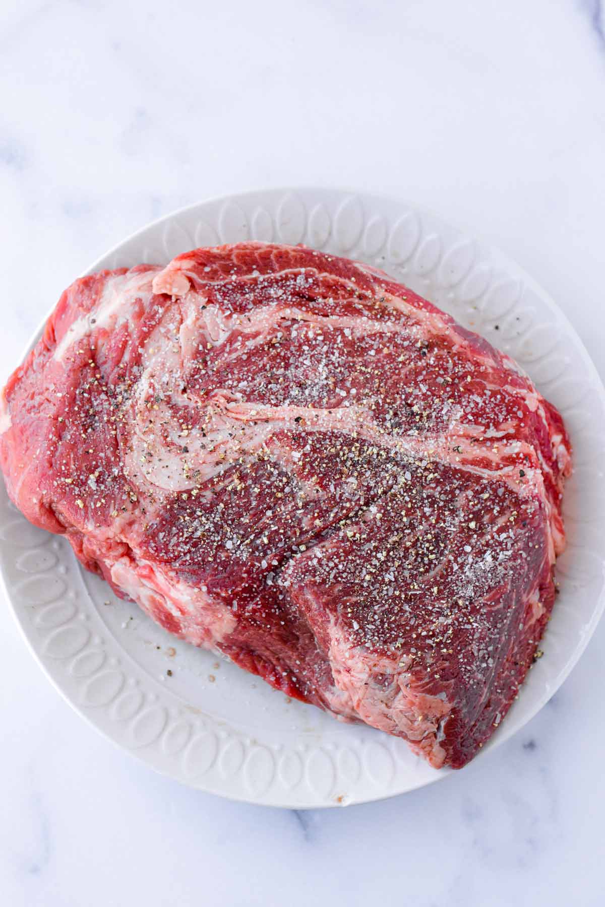 seasoned chuck roast with salt and pepper