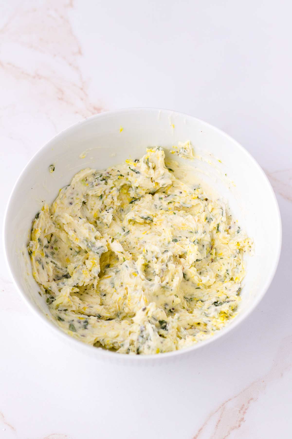 softened herbed butter in a bowl