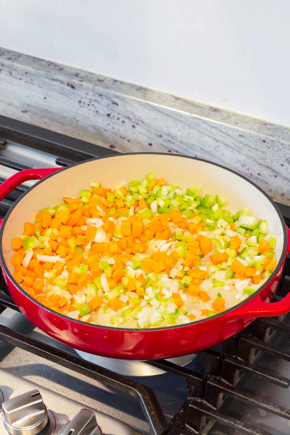 sauteeing the diced vegetables in a dutch oven