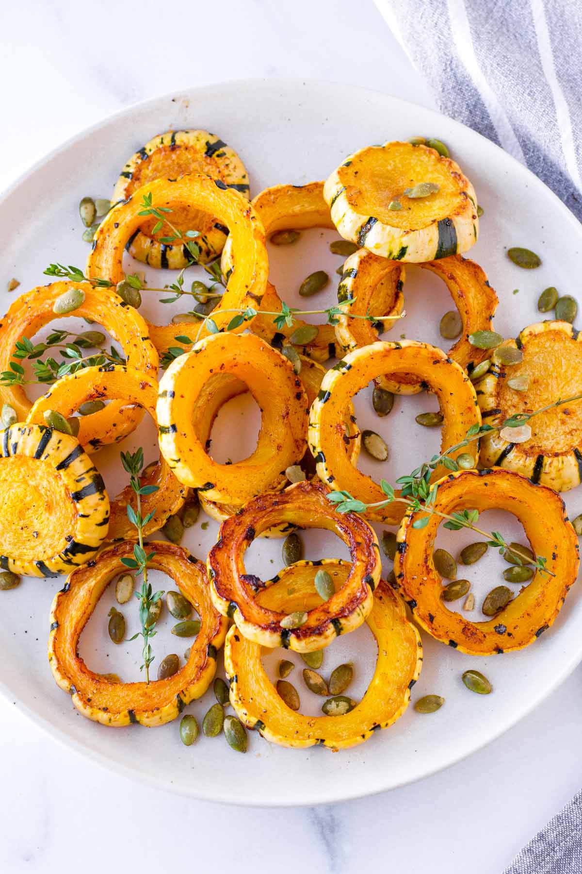 seasoned baked delicata squash in a round plate