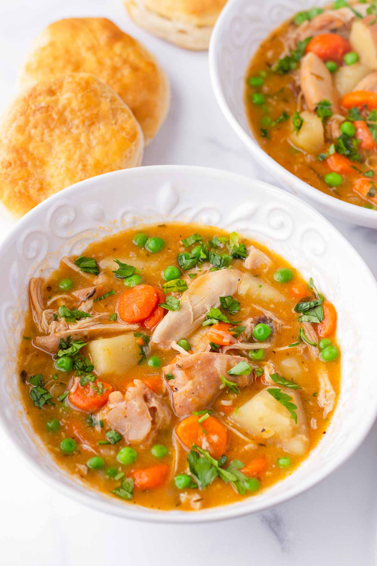 chicken stew in bowls with biscuits