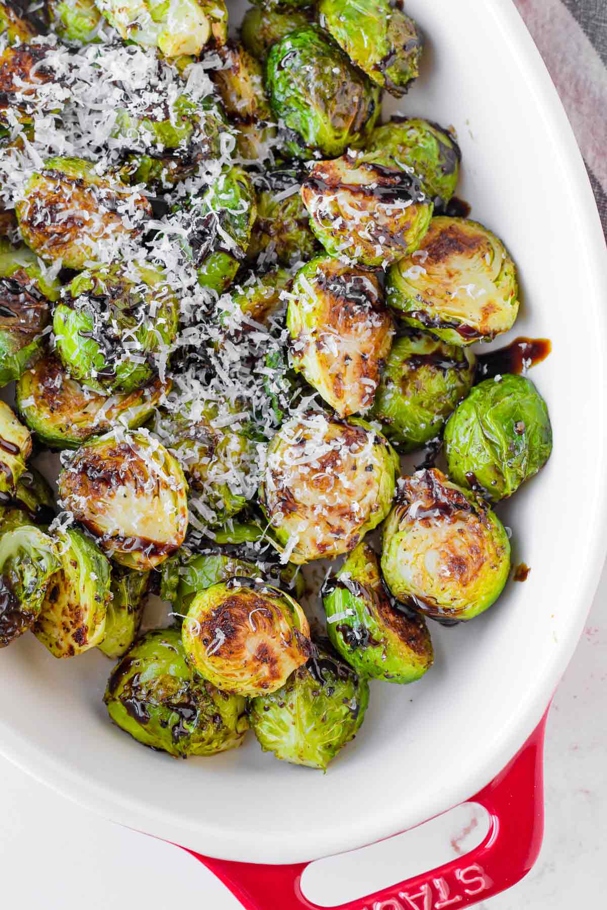 roasted brussels sprouts with balsamic glaze in oval dish