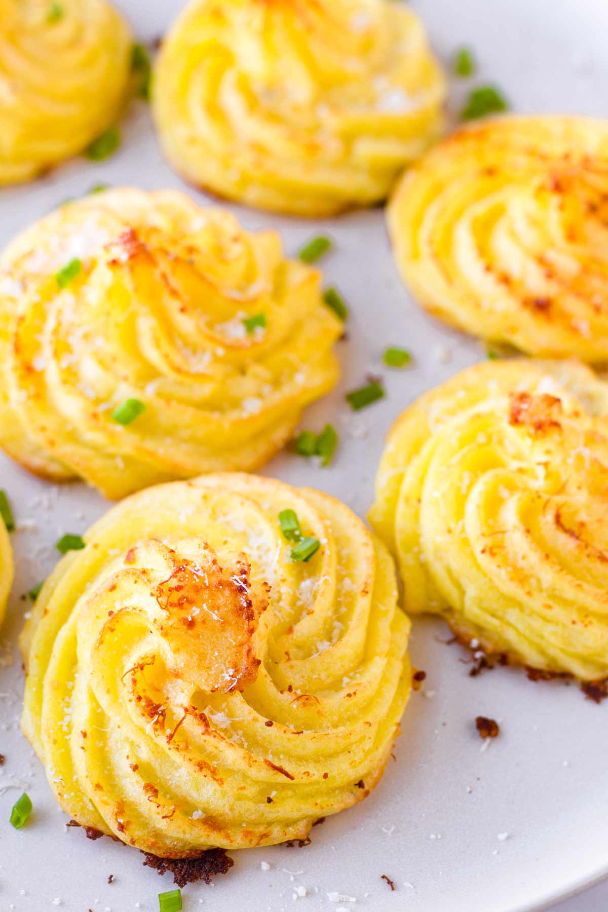 close up of baked duchess potatoes side dish