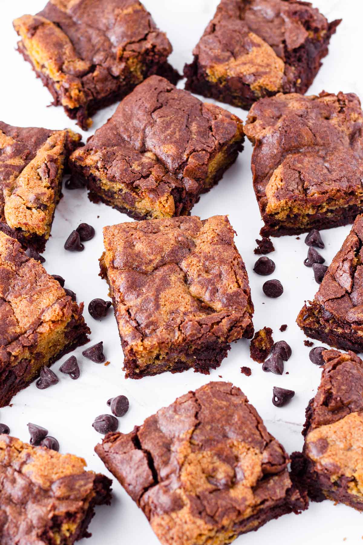 brookies cut into squares with chocolate chip morsels on table