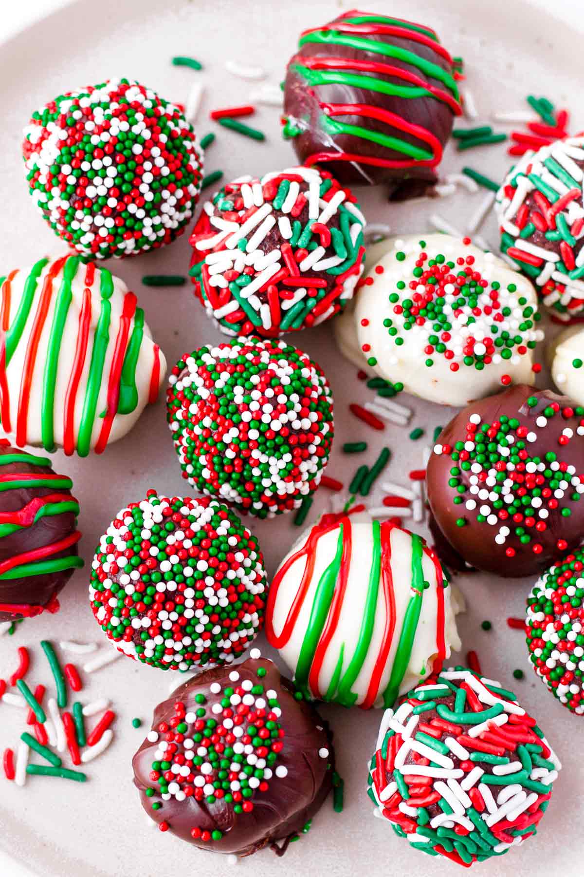 several Christmas truffles dipped in chocolate and sprinkles