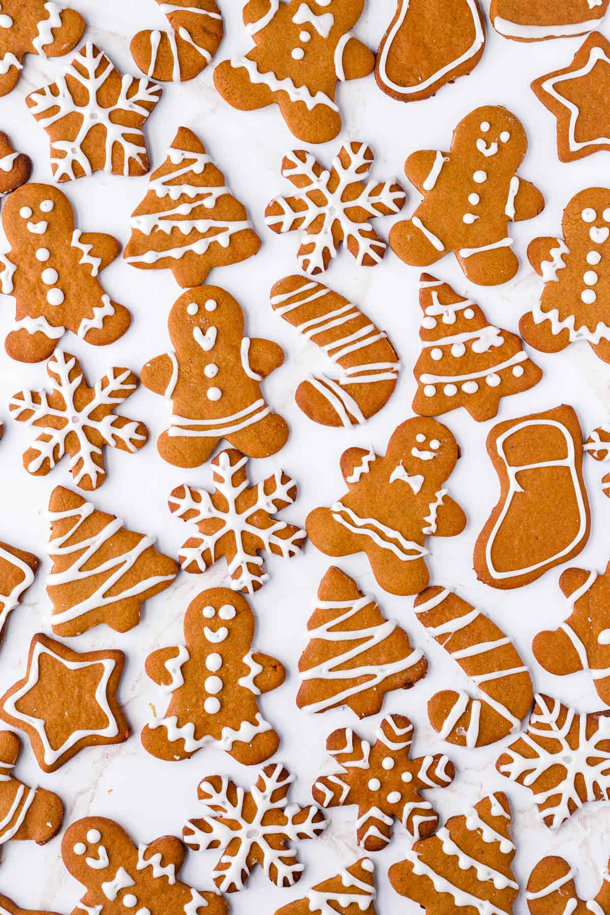 decorated gingerbread cookies of many holiday shapes