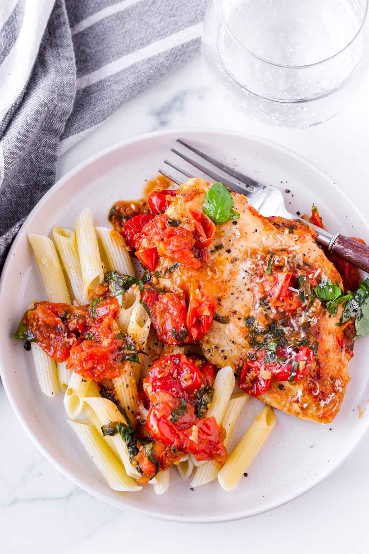 chicken pomodoro with penne on a plate