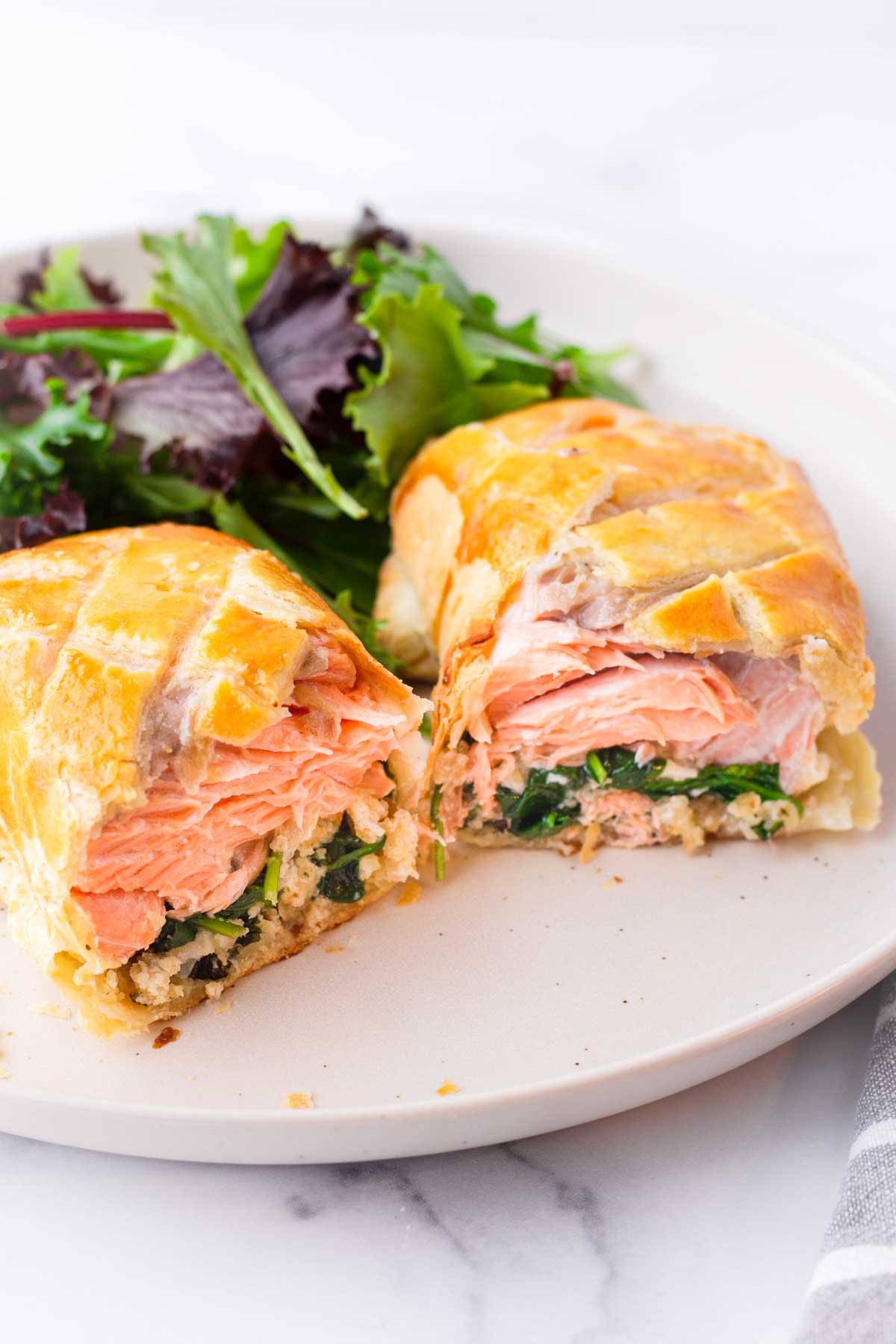 salmon en croute made with puff pastry cut into half