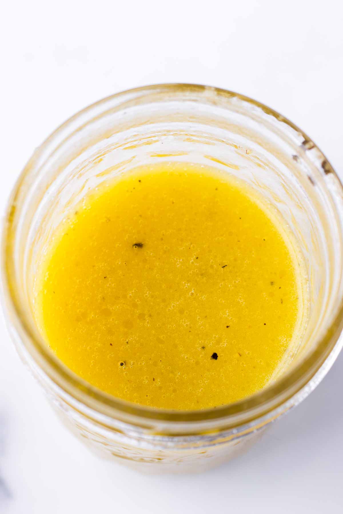 prepared honey lemon dressing in a mason jar