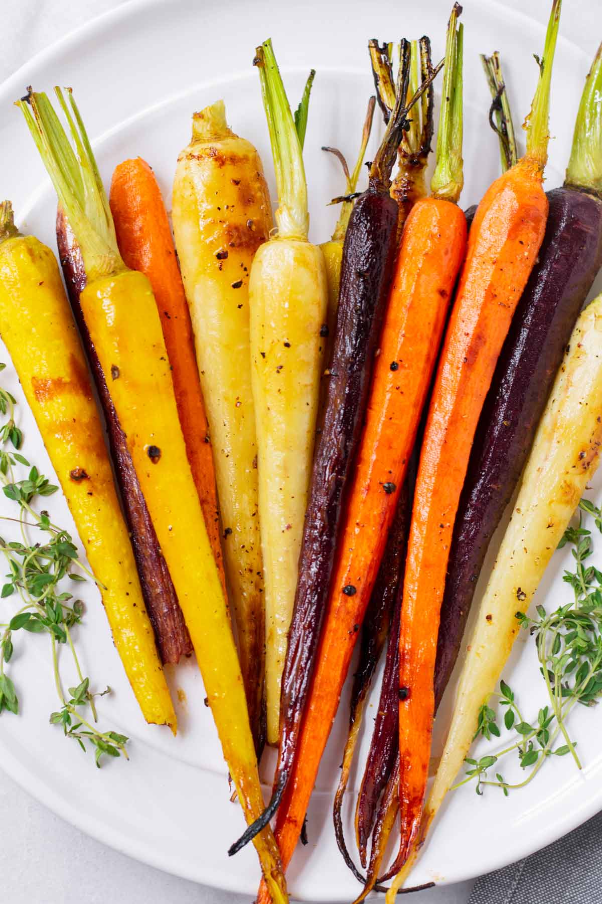 platter with a bunch of roasted multi color carrots