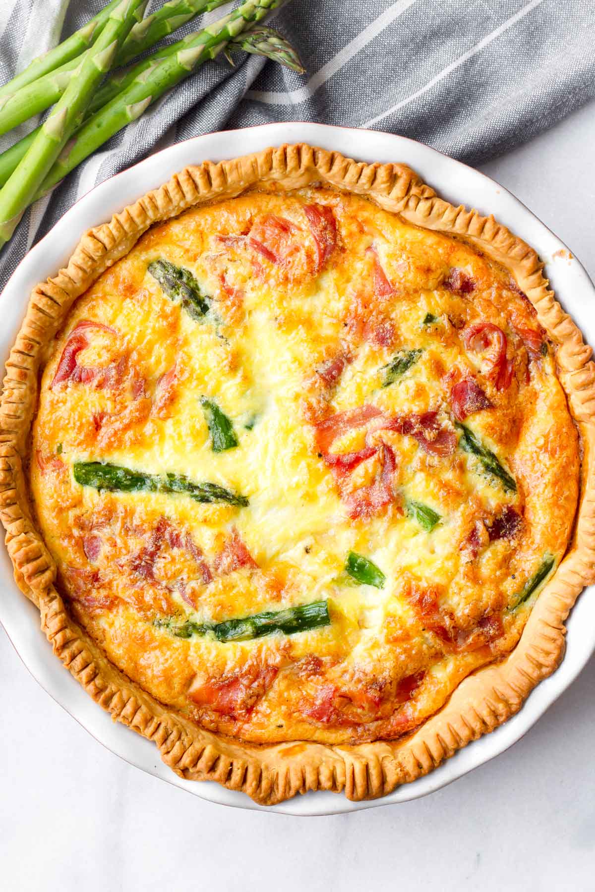 top view of egg quiche made with asparagus and prosciutto