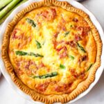 baked egg quiche with spring vegetables and prosciutto