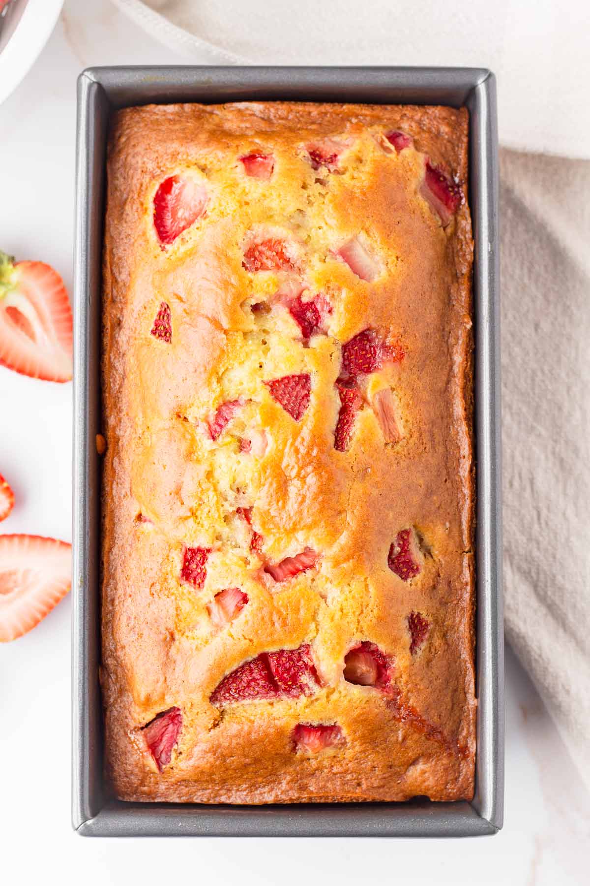 baked strawberry loaf in a baking pan