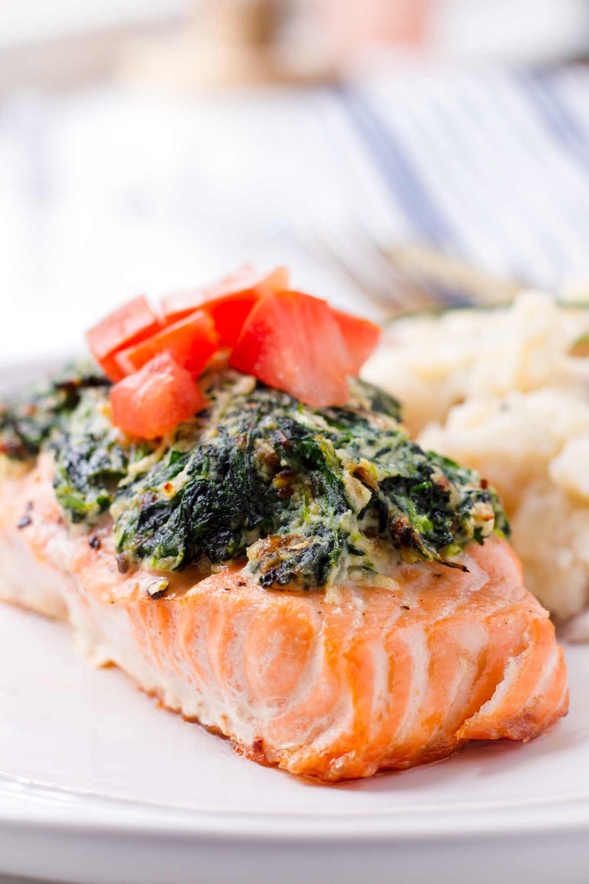 side view of a fillet of spinach and ricotta stuffed salmon