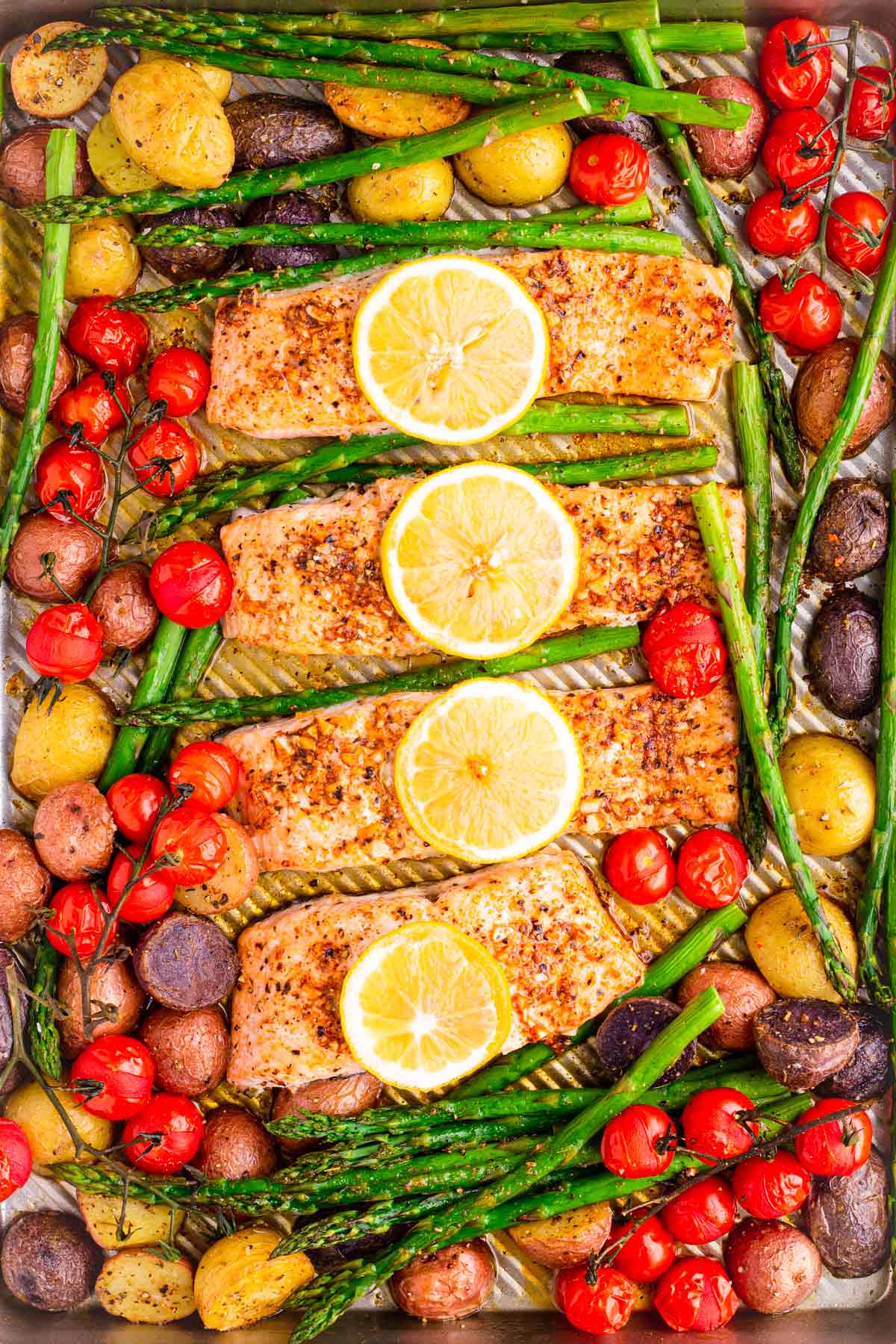 top of of baked sheet pan salmon with vegetables