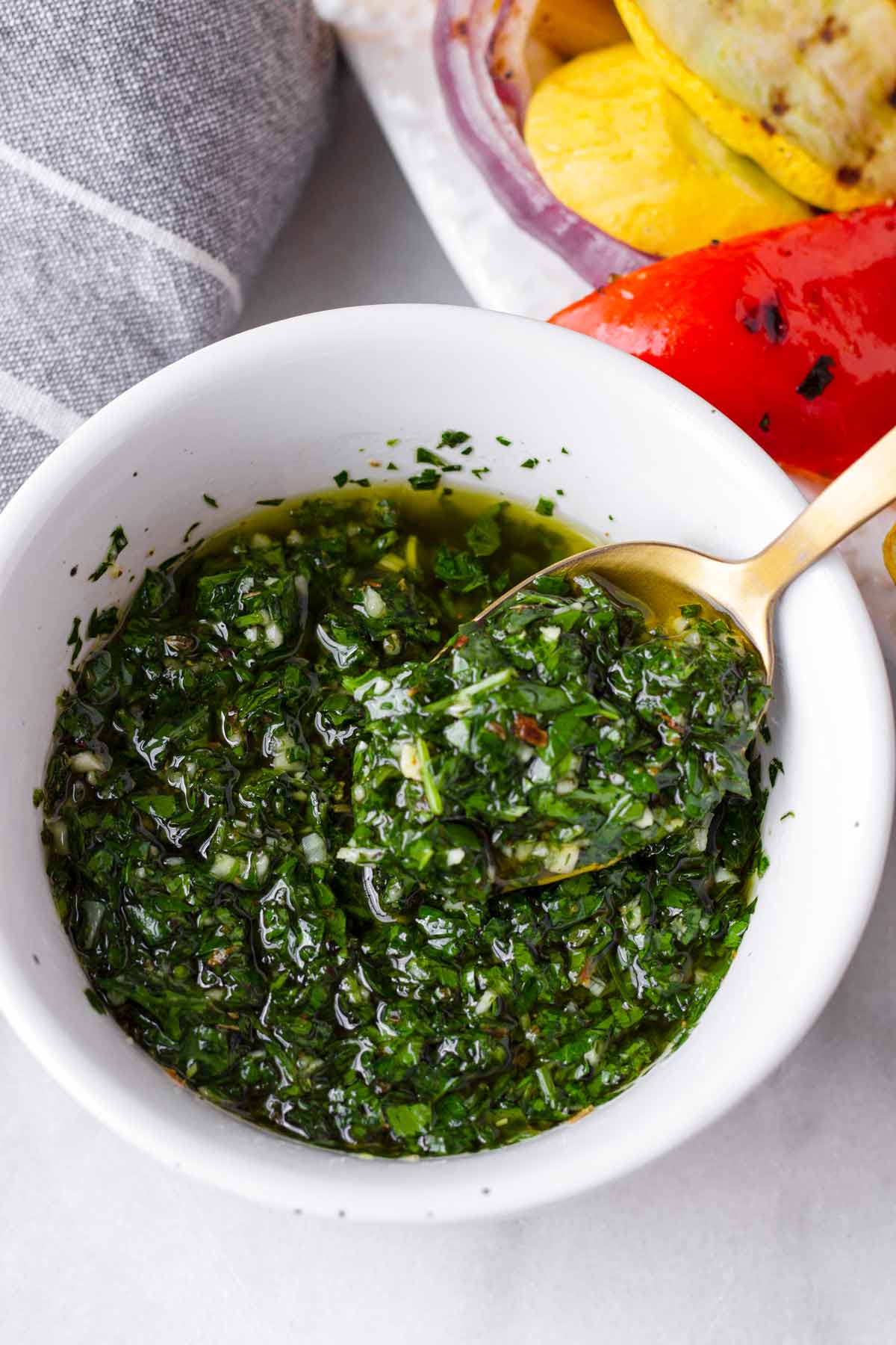 argentinian chimichurri sauce in a bowl with a spoon