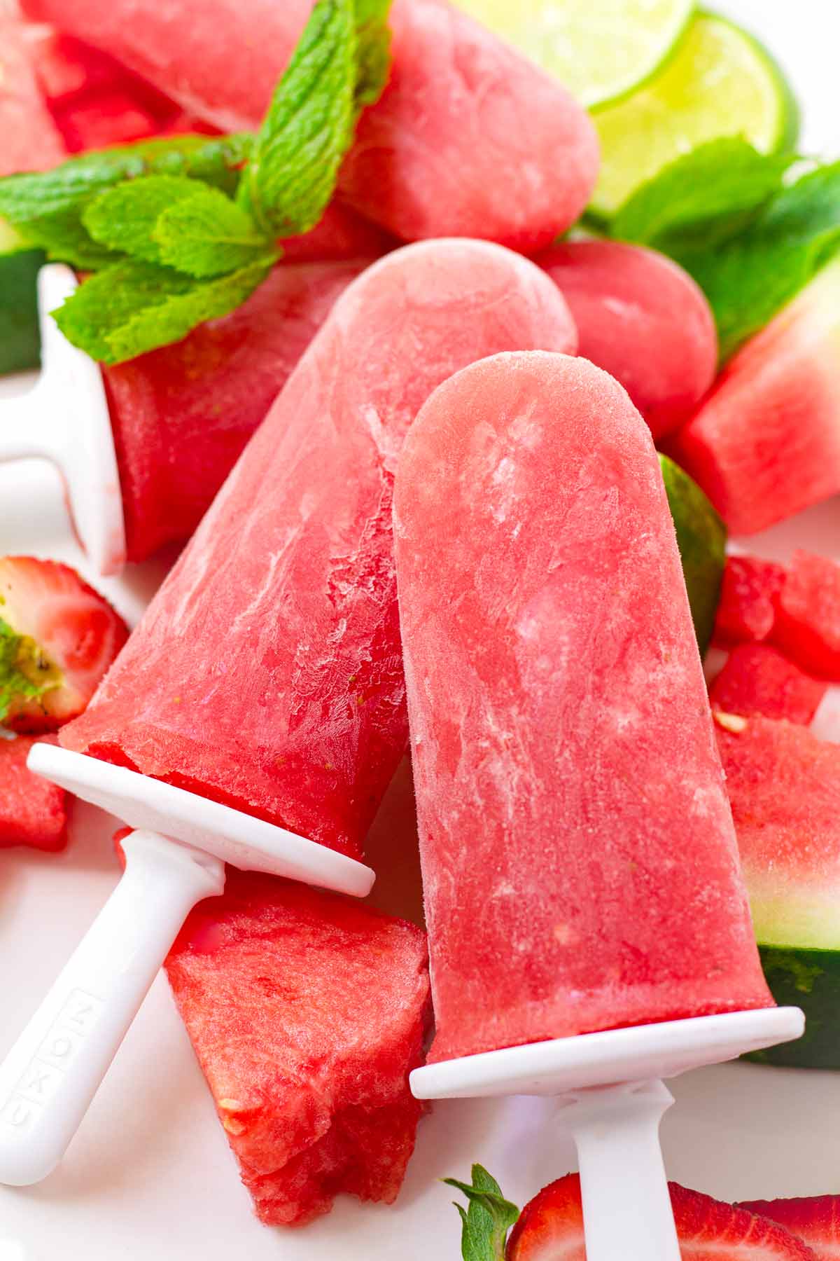 two propped up watermelon popsicles