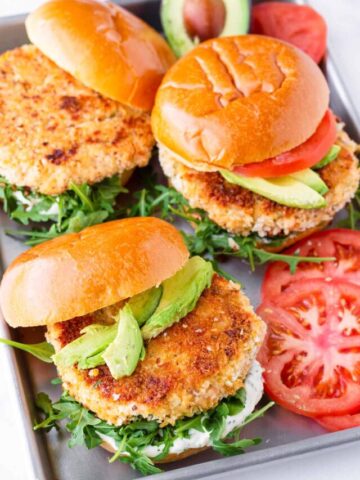 three salmon burgers on a sheet pan
