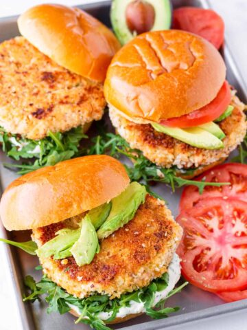 three salmon burgers on a sheet pan