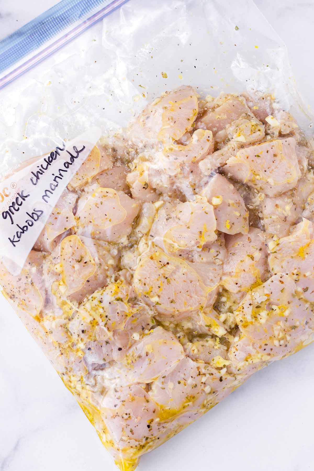 chicken cubes with marinade inside a resealable bag