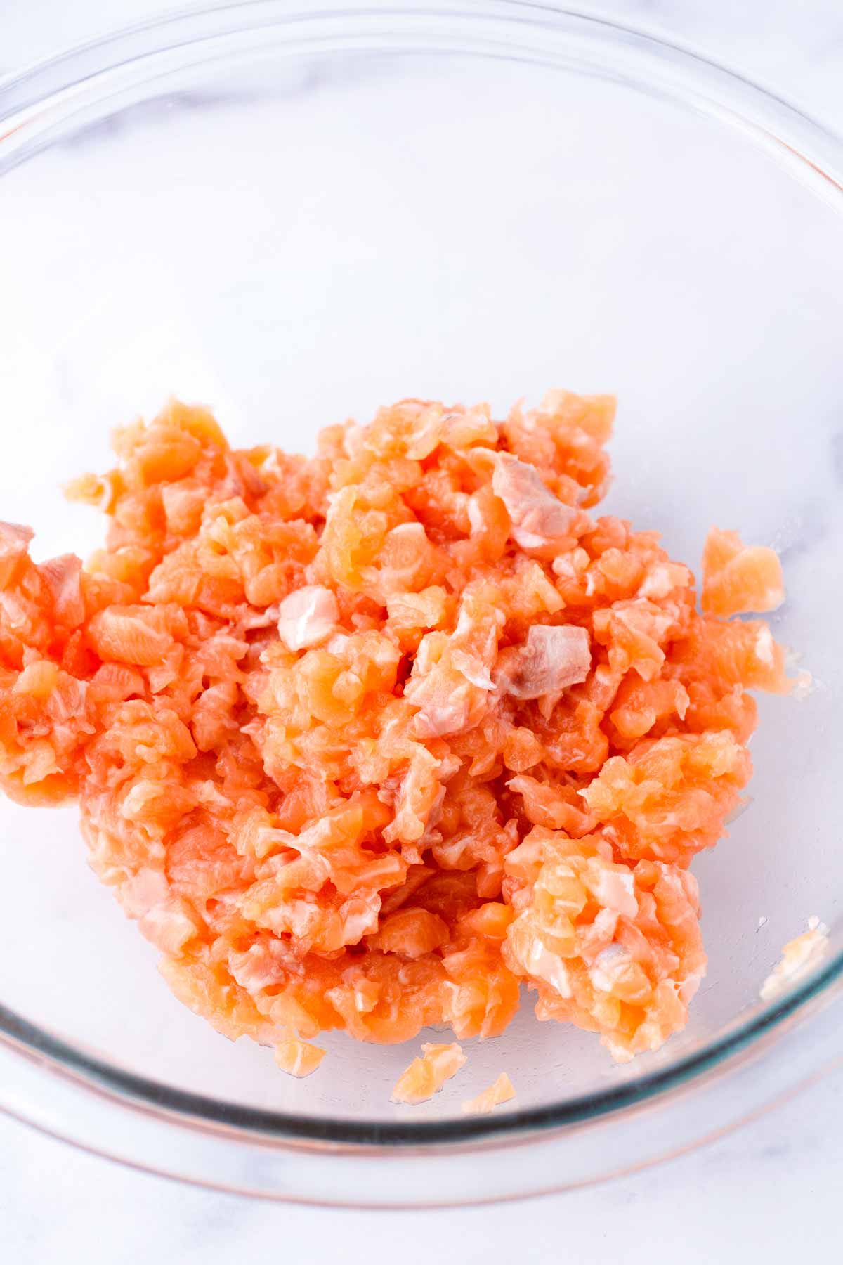 small diced salmon in a glass bowl