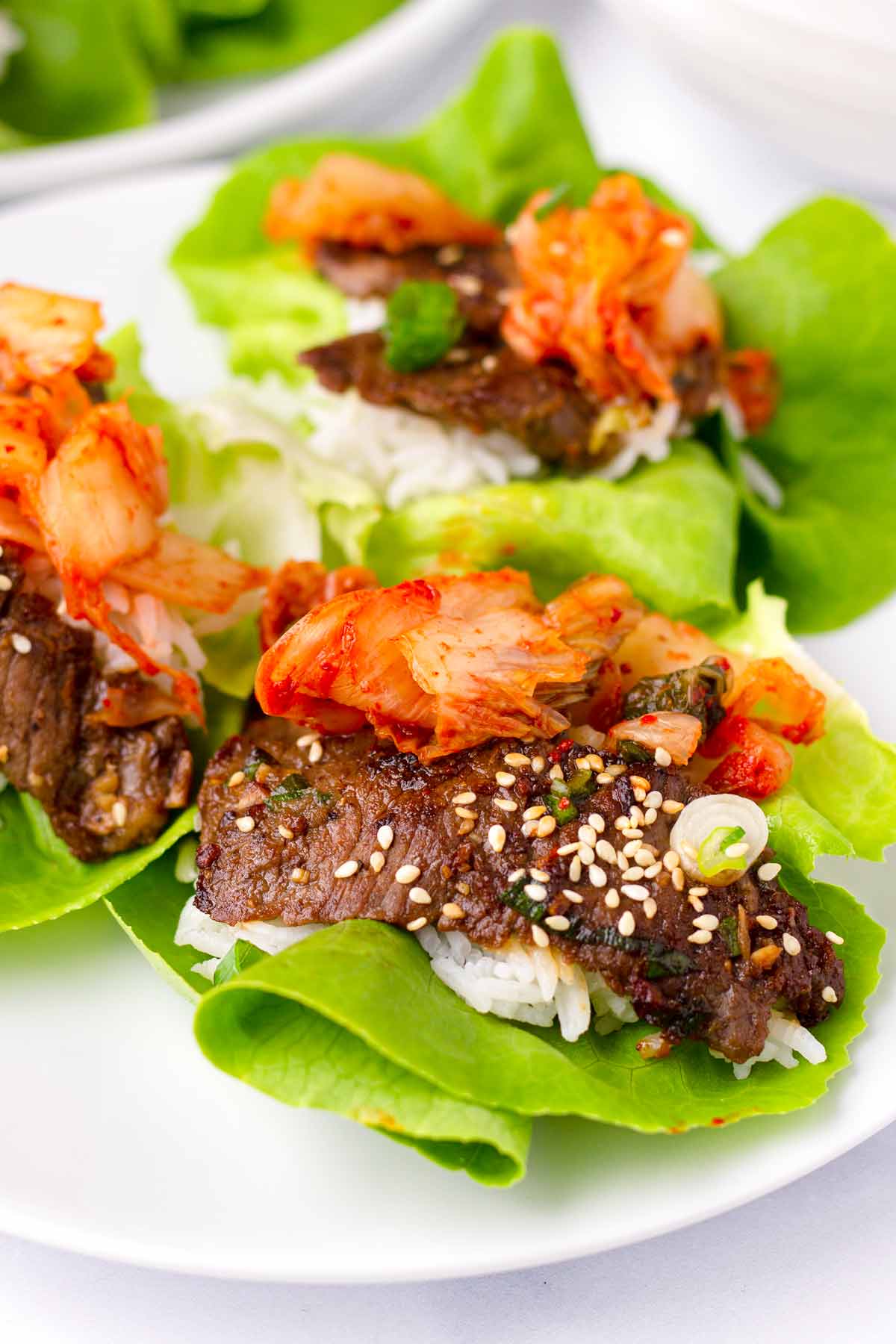 close up of korean beef lettuce wraps with kimchi