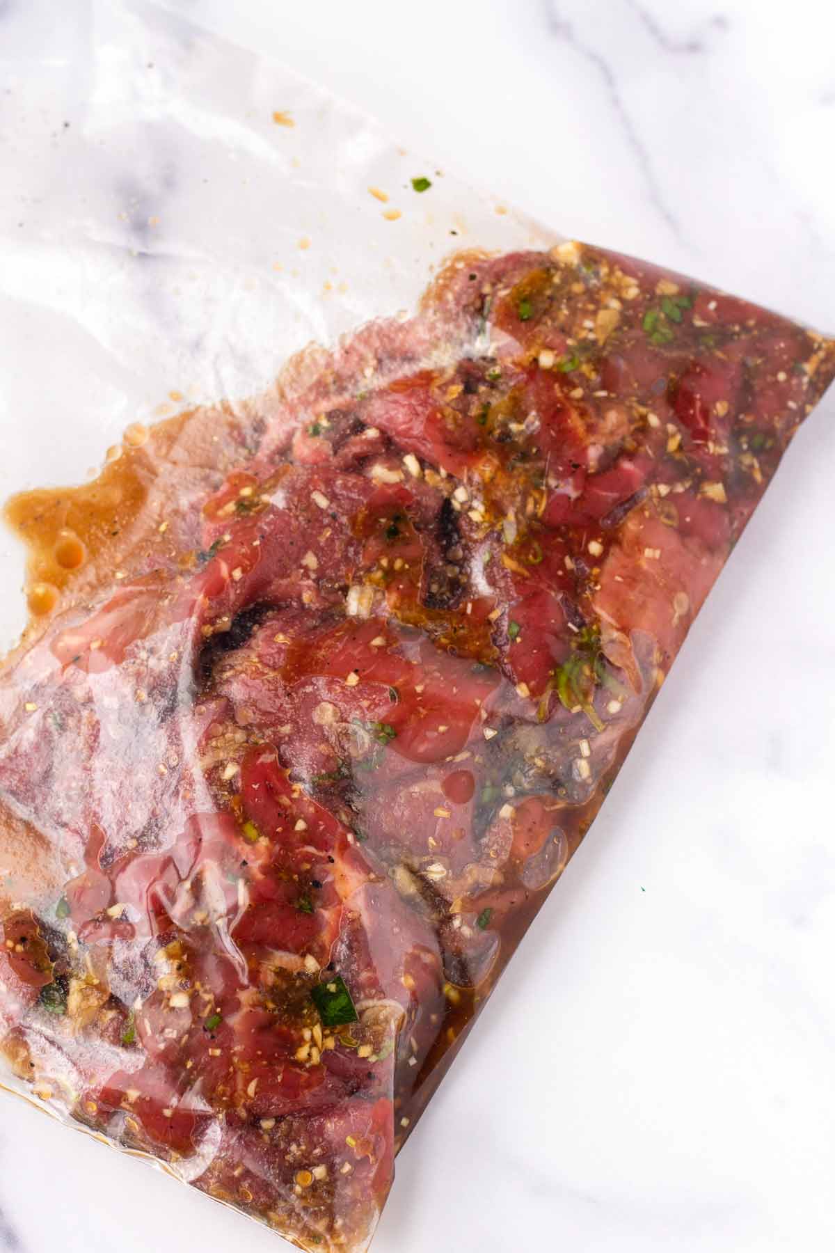 marinating sliced beef in a resealable plastic bag