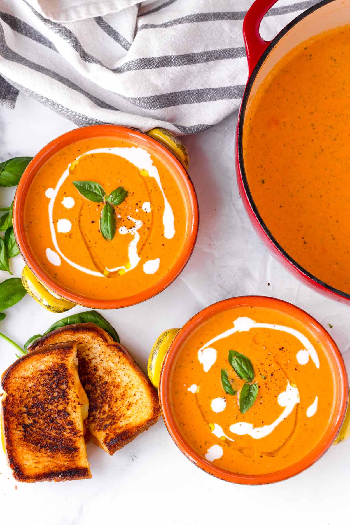 creamy tomato soup with basil and grilled cheese croutons