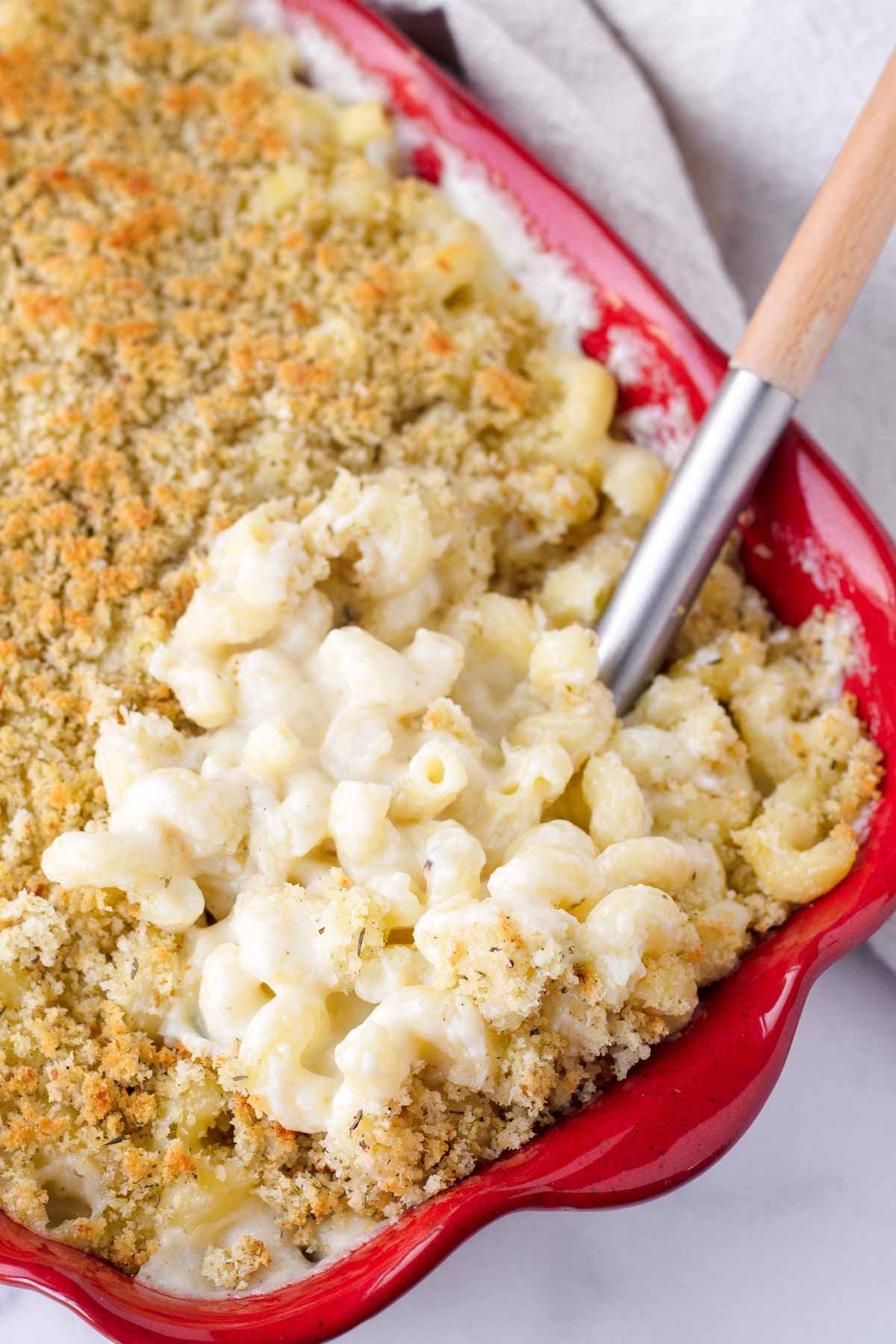 baked white cheddar mac and cheese in a red baking pan