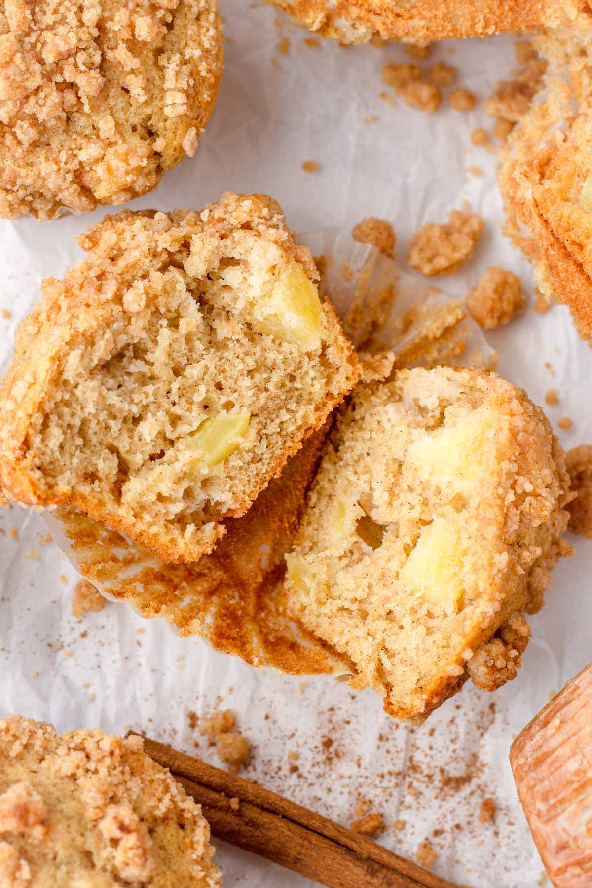 an apple crumb muffin split in half