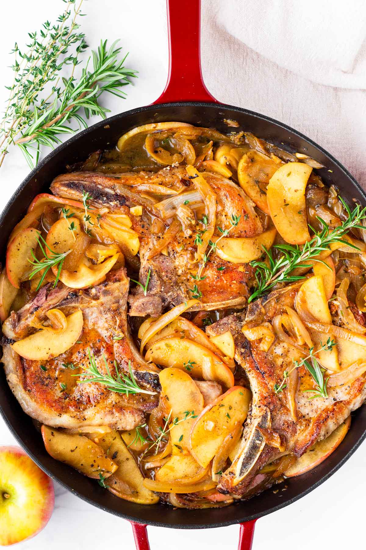 seared bone in pork chops with apples and onions