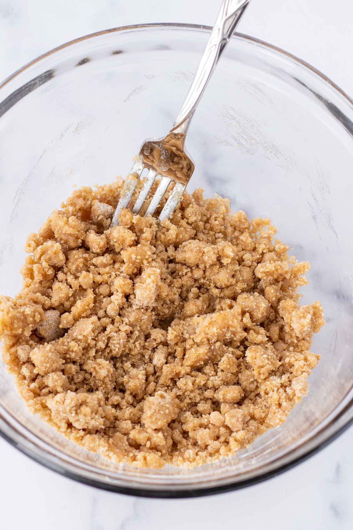 mixed crumb topping in a bowl with a fork