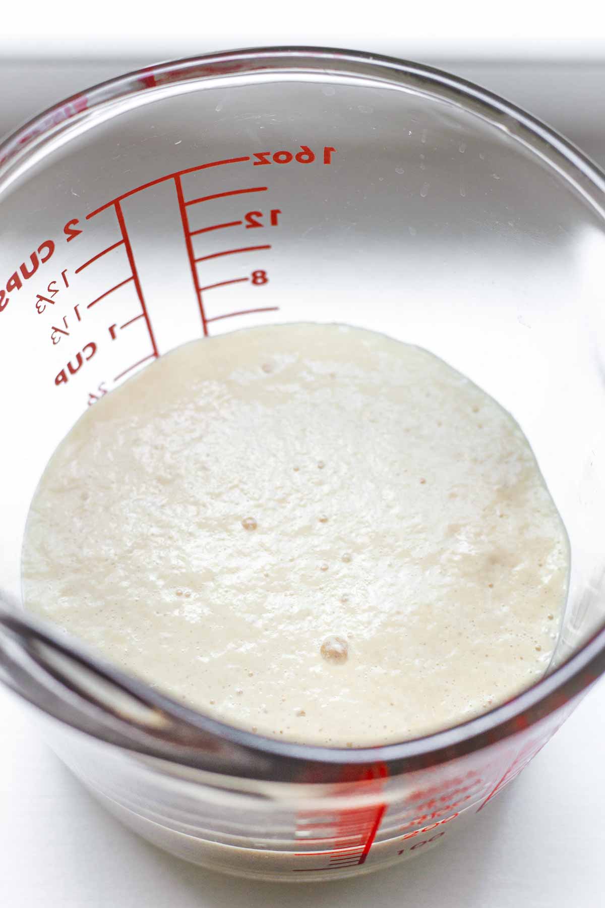proofing yeast in a glass measuring cup