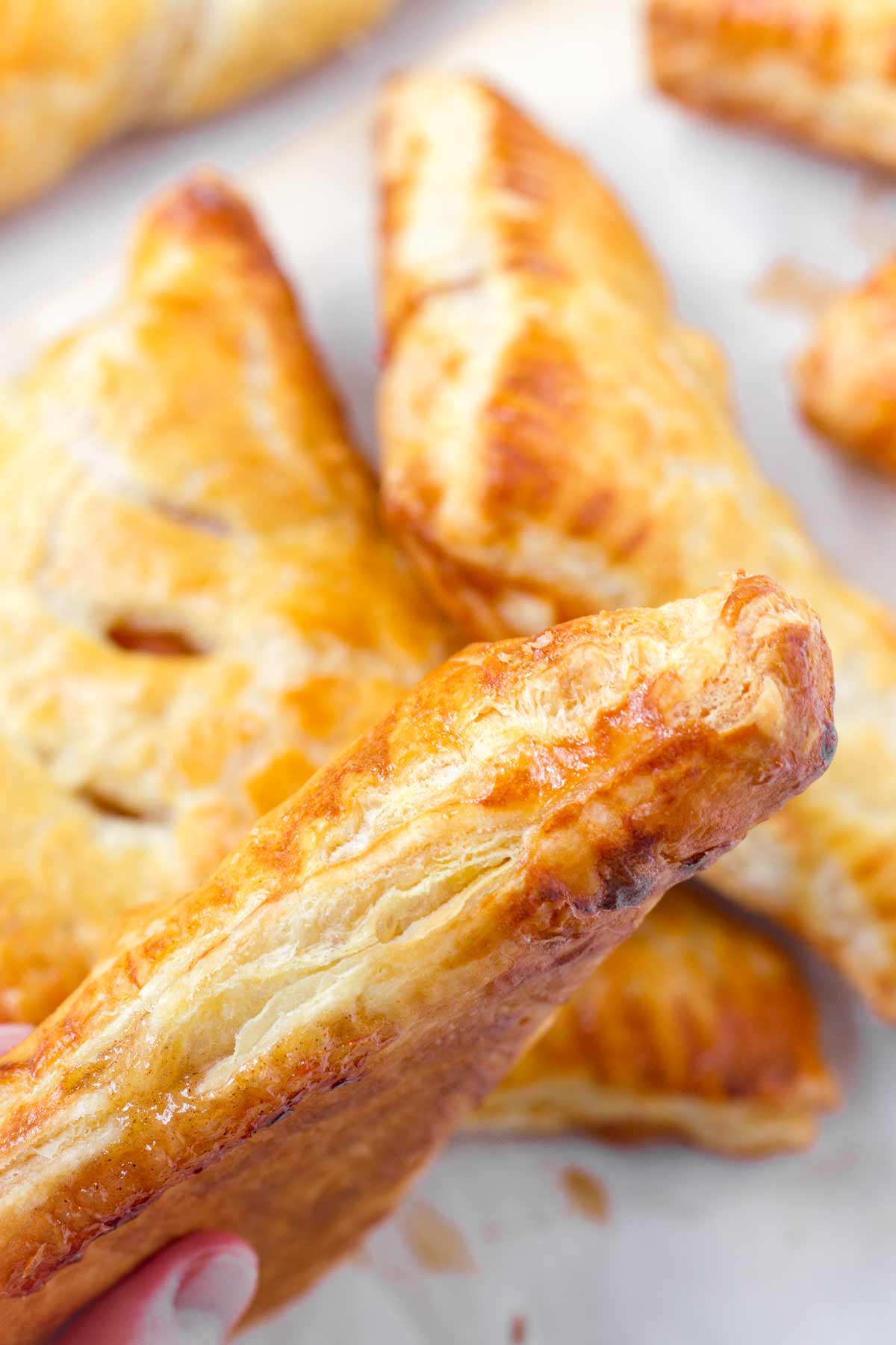 showing the flaky side of an apple turnover