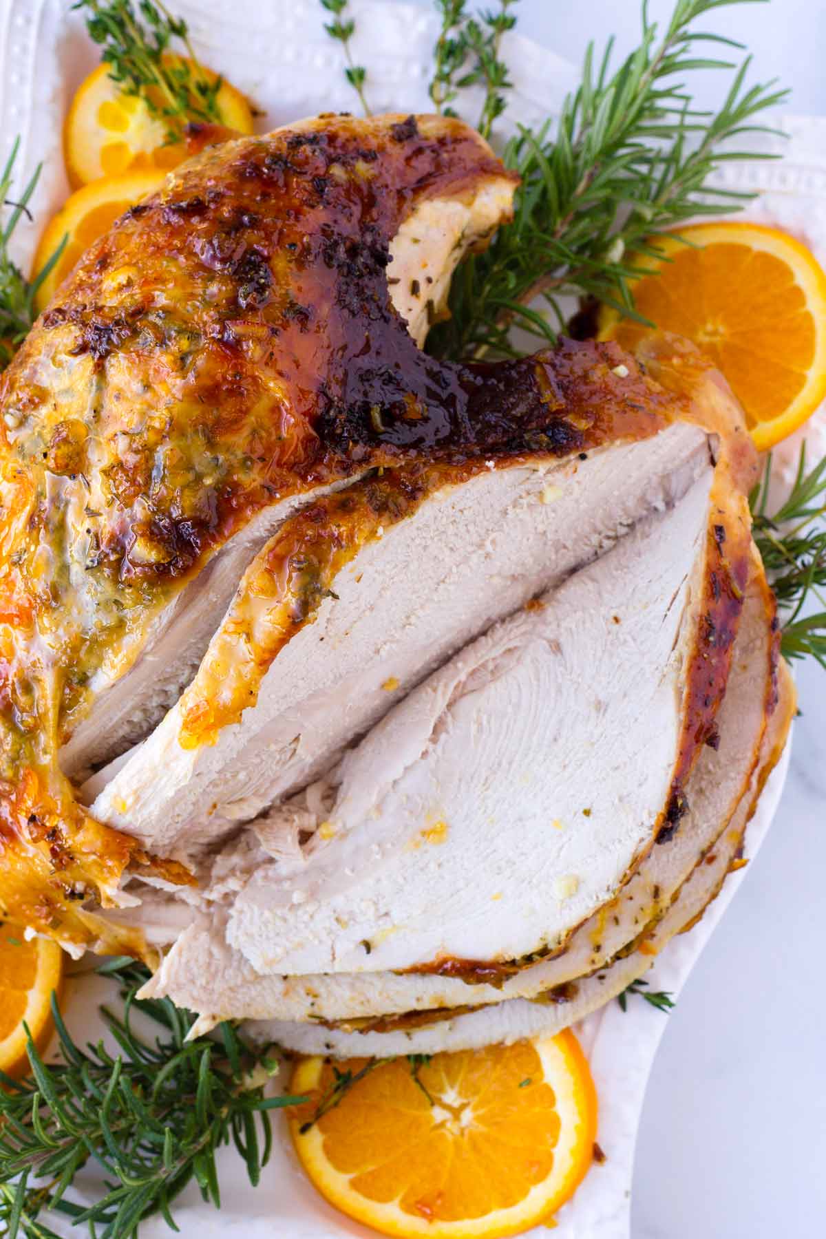 sliced turkey breast on a decorated platter