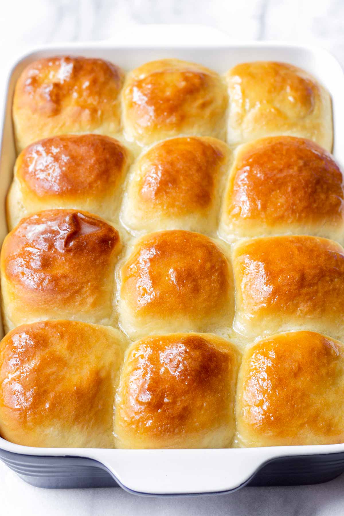 a 9 by 13 inch square dish with 12 dinner rolls