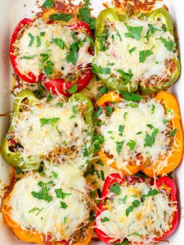 six servings of ground turkey stuffed bell peppers with cheese