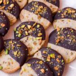 pistachio shortbread cookies dipped in dark chocolate