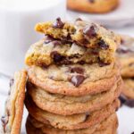 a cookie split in half sitting on a stack of cookies