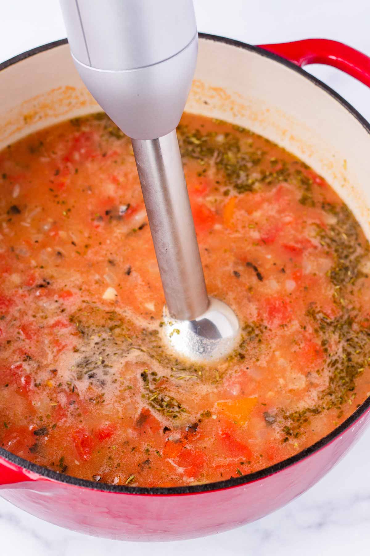 blending soup with an immersion blender