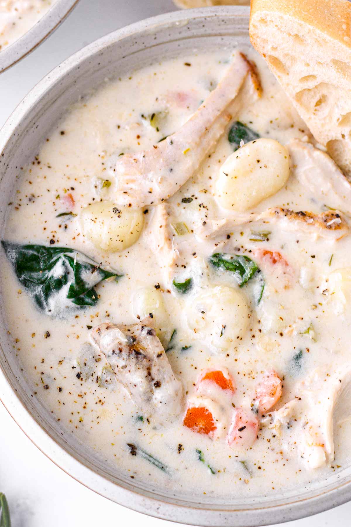 close up of creamy chicken gnocchi soup bowl