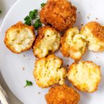 fried mac and cheese bites on a plate