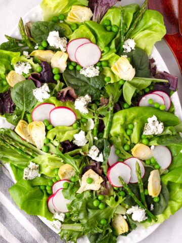fresh spring-inspired green salad with goat cheese
