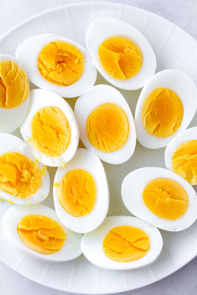 hard boiled eggs cut in half on a plate