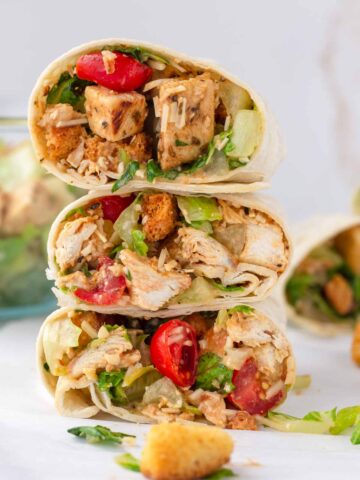 three chicken wraps cut into half and stacked