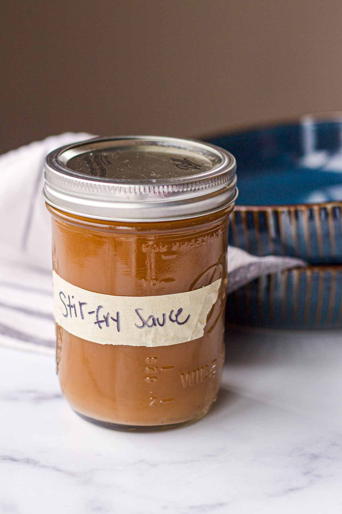 stir fry sauce inside a labeled mason jar
