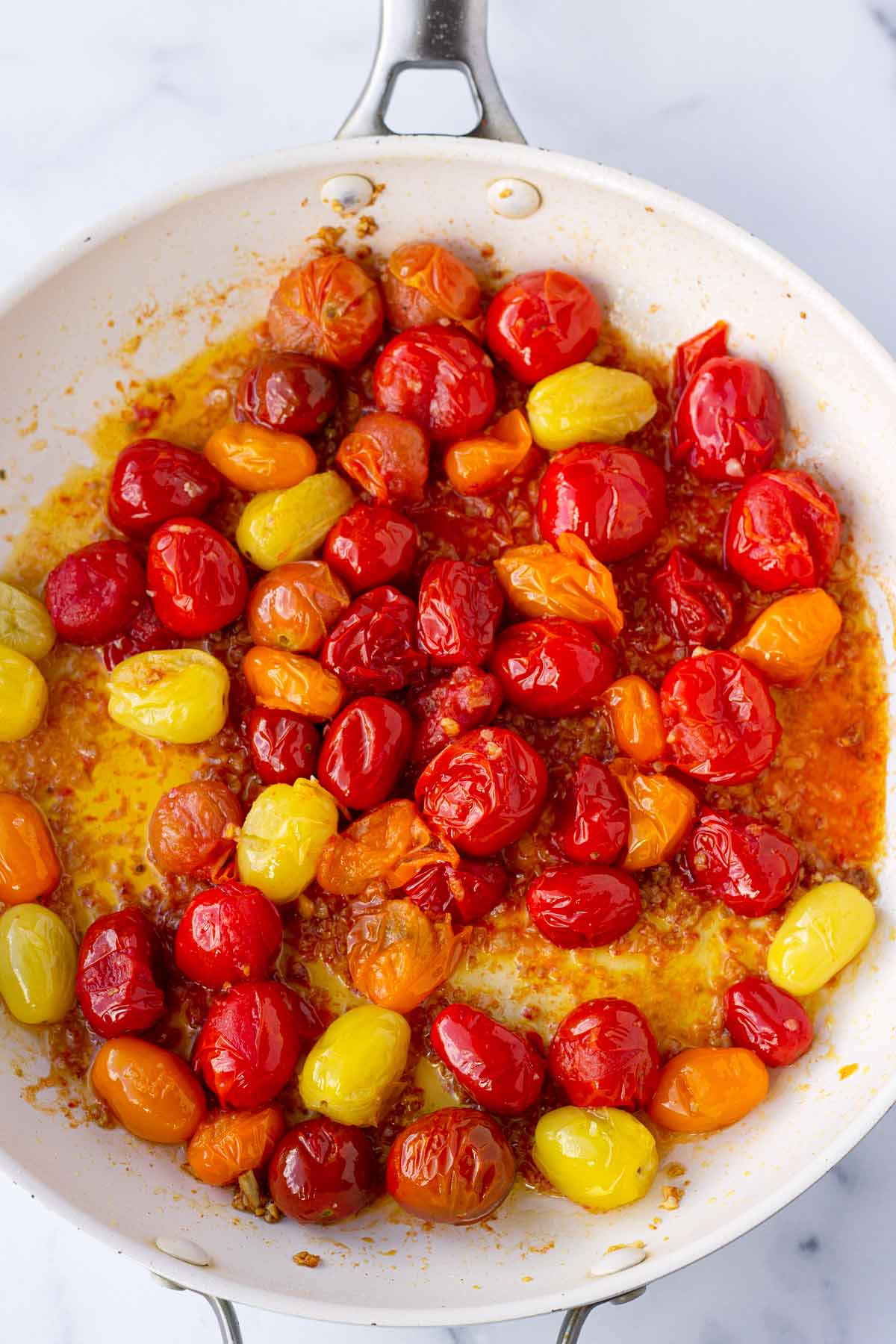 blistered cherry tomato sauce in skillet