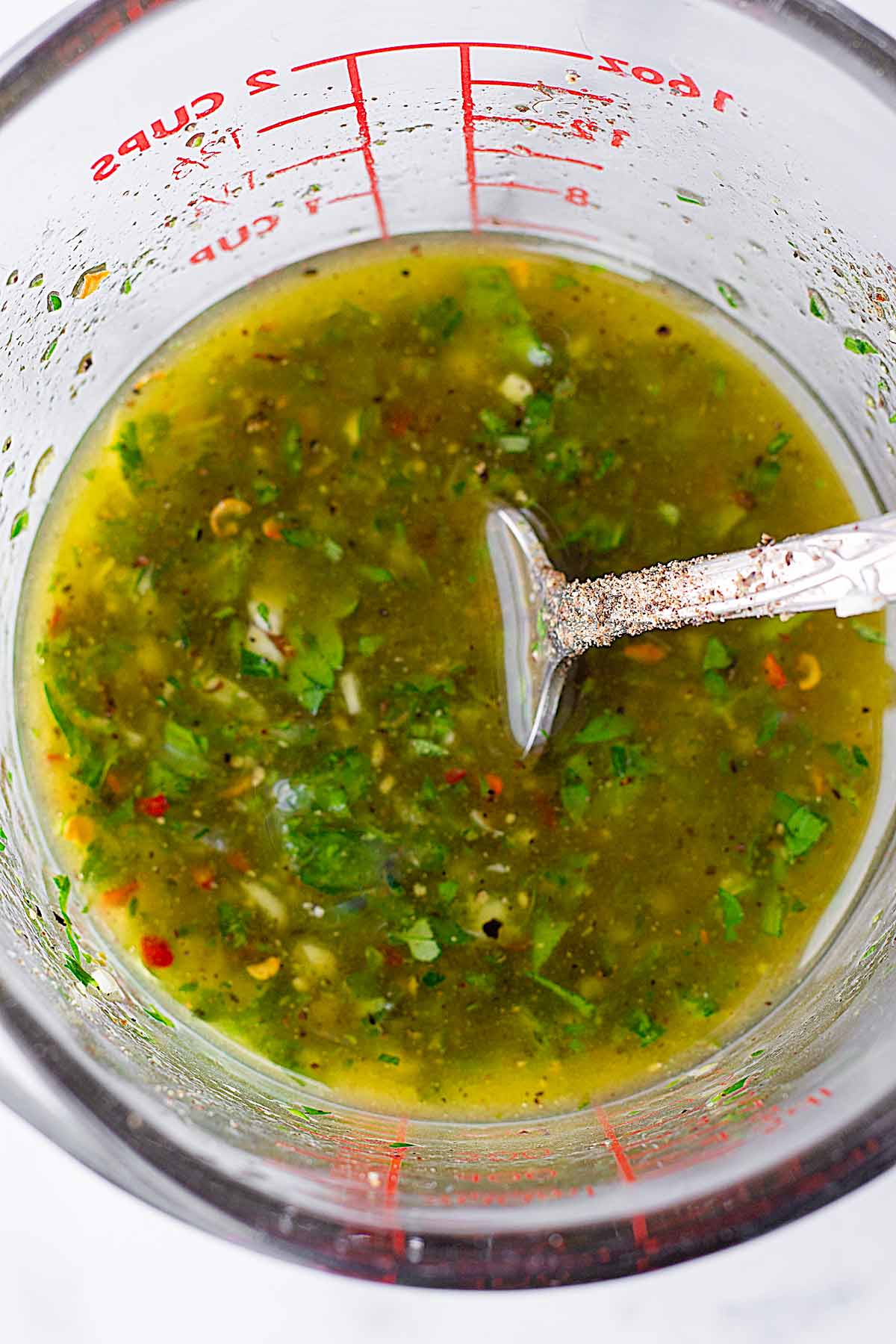 mixed marinade in a glass measuring cut
