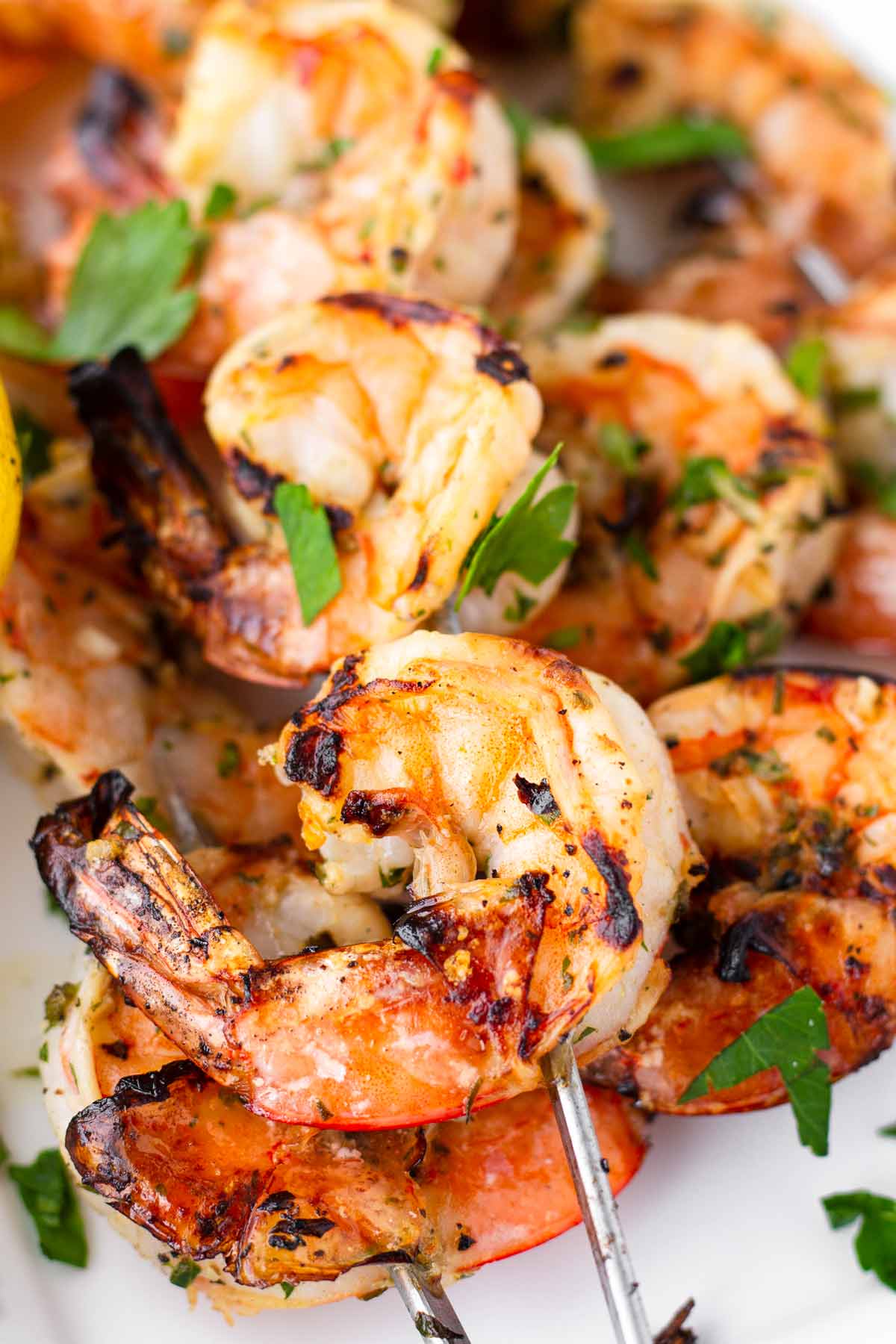 close of of charred marinated grilled shrimp